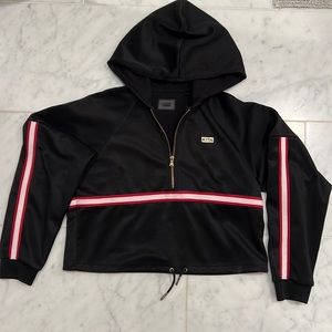 KITH women’s crop black nylon hoodie with red & white arm stripe. Size small.